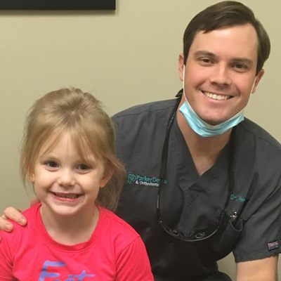 Dr. posing with a young patient.