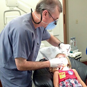 Dentist working on patient