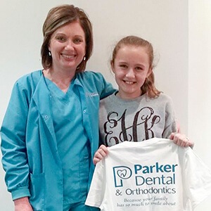 team member smiling with patient