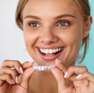 woman clear aligner smiling