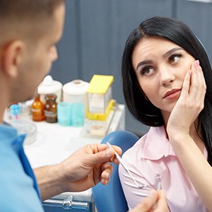 Emergency dentist in Mobile speaking to a patient