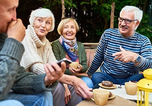 Friends enjoying a conversation outdoors