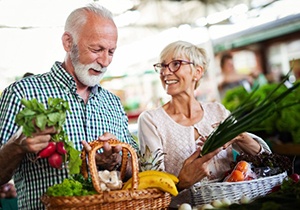 Couple buying vegetables at a farmer’s market