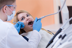 Woman receiving dental treatment