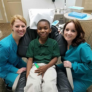 two team members with patient