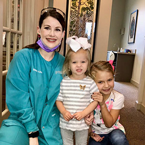 team member with two young patients