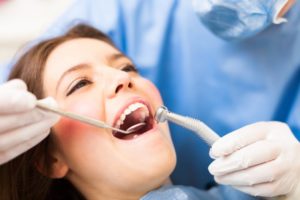 woman smiling during dental exam