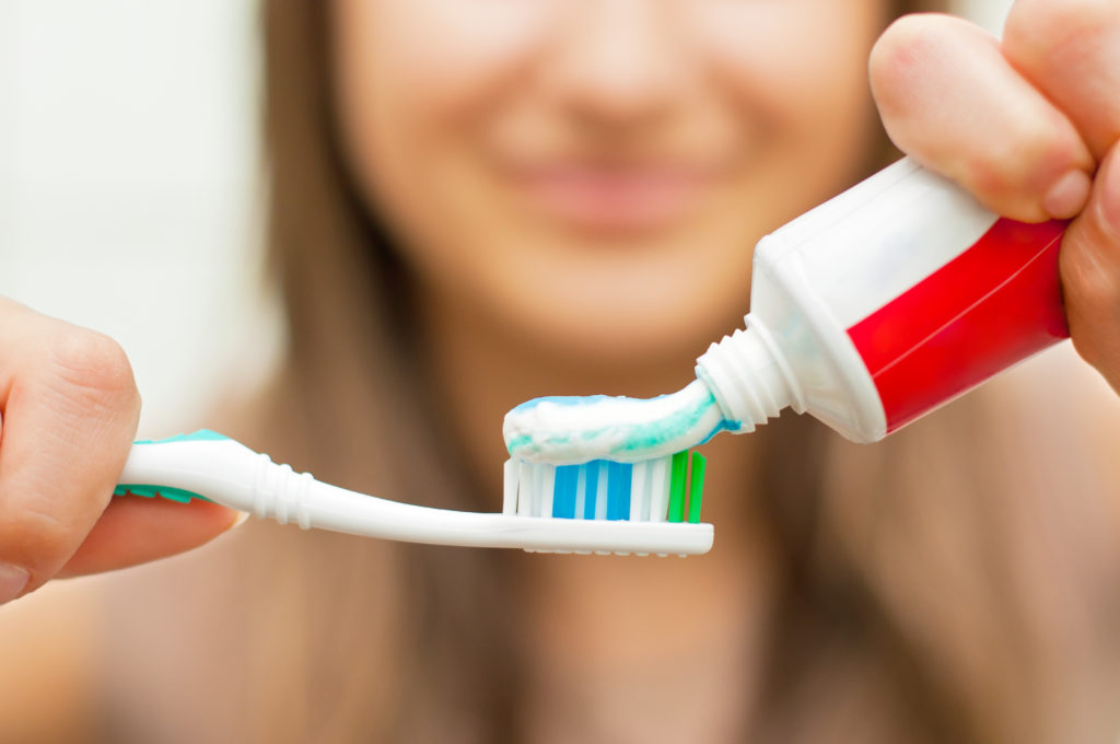 woman following oral hygiene instructions from Mobile dentist