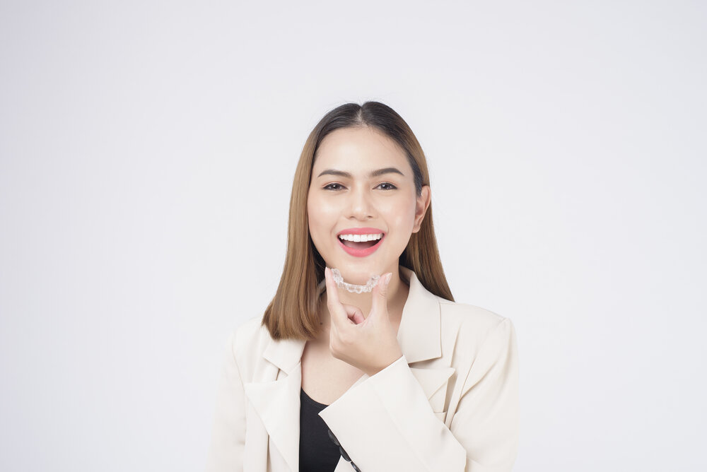 person smiling with their Invisalign