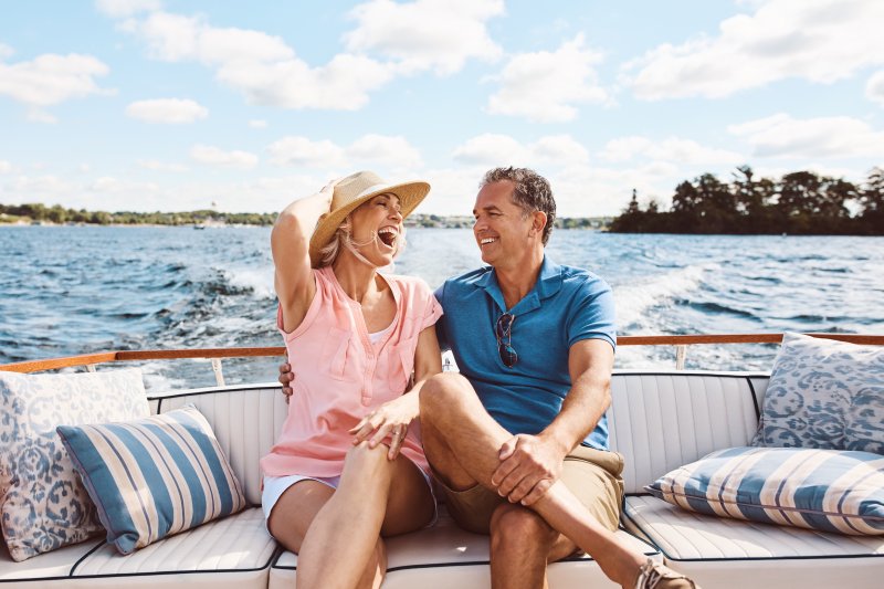a mature couple on a boat ride during the summer