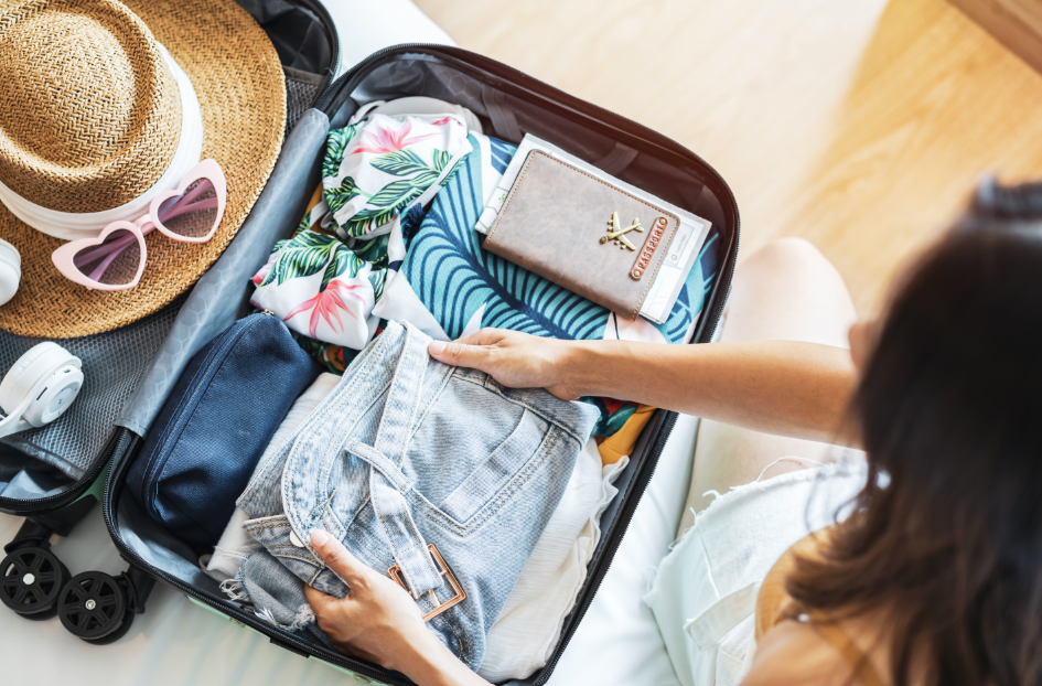 Woman packing suitcase